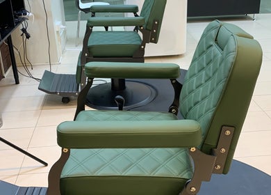 Green leather barber chairs at Men’s Portal Barbershop, Perth, Western Australia, AU.