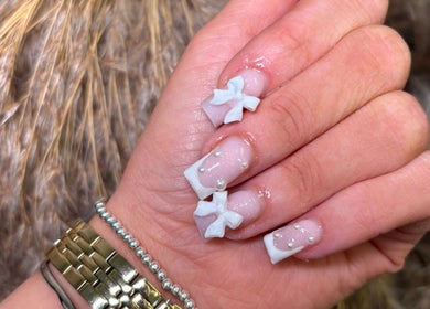 Elegant nail design with bows at Beauty by Livv, Burnley, England, GB.