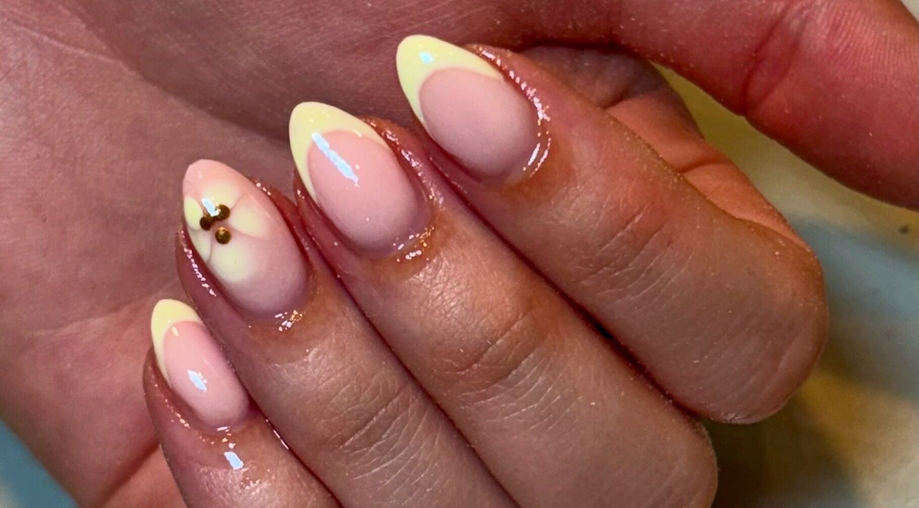 Stylish nail art featuring soft pink and yellow at Beauty by Livv, Burnley, England, GB for a chic look.