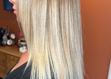 Sleek blonde hair styled at Heather Schreiber in Niagara Falls, New York, US, showcasing professional salon services.