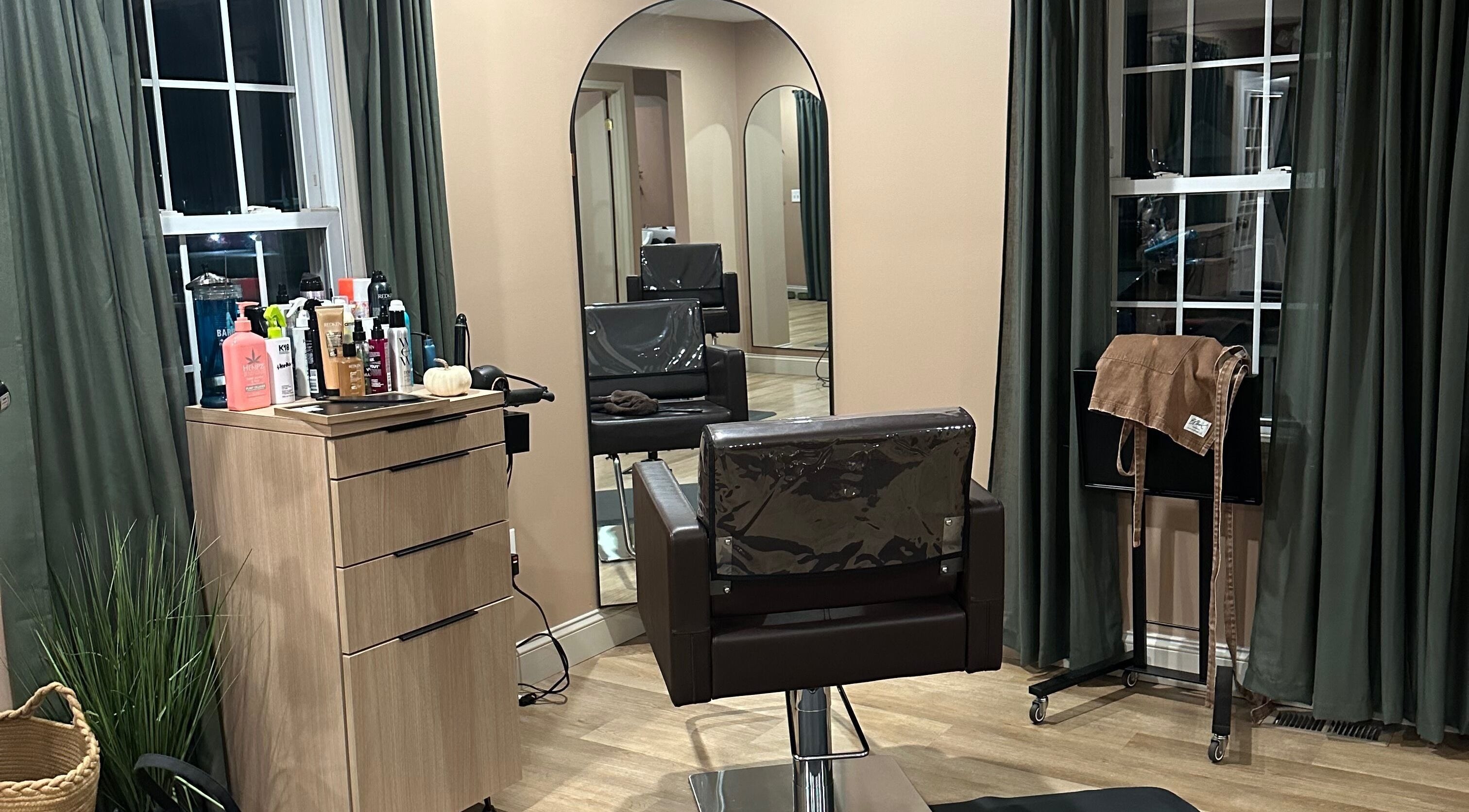 Elegant salon chair and mirror at Heather Schreiber, Niagara Falls, New York, US.