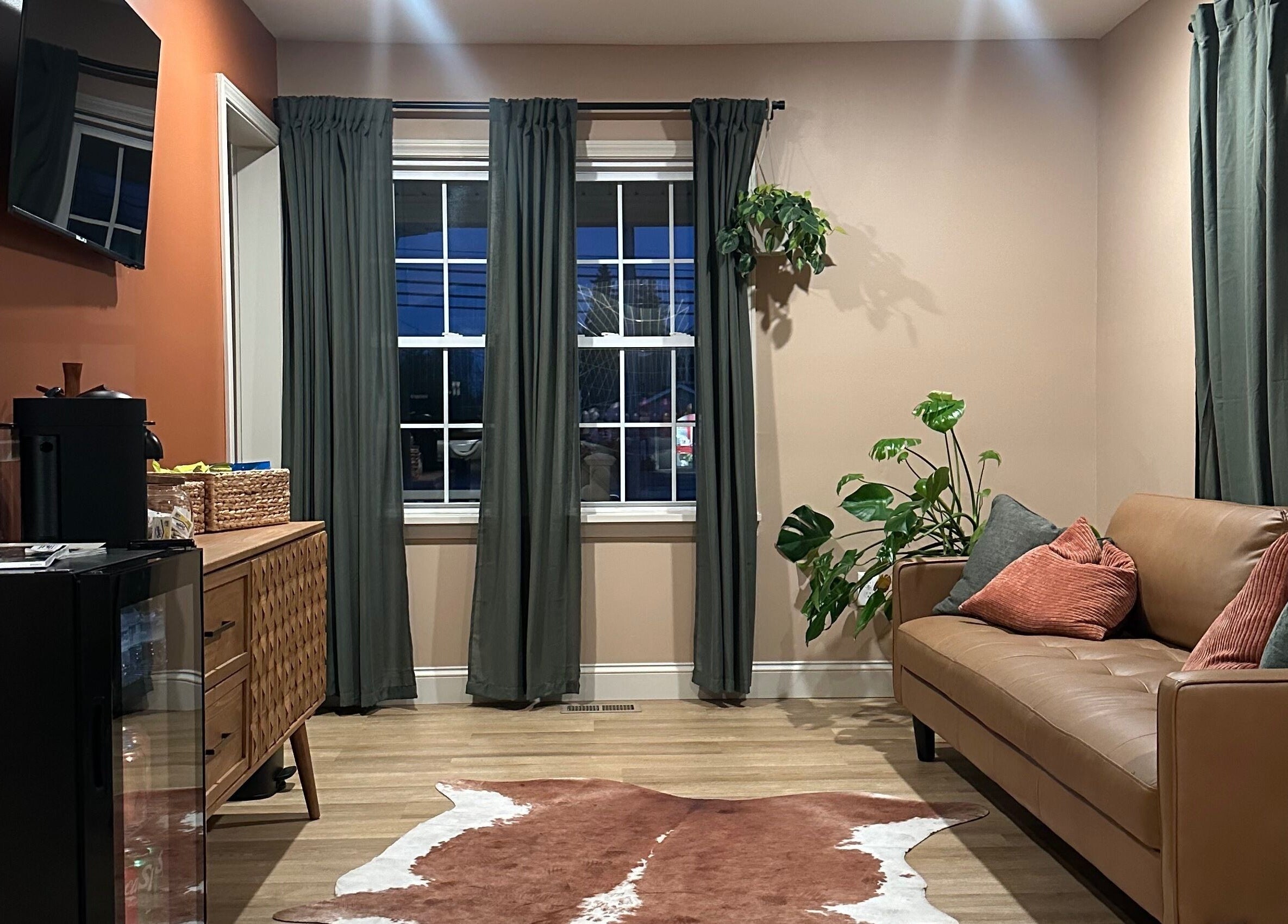 Inviting lounge area at Heather Schreiber, Niagara Falls, New York, US with elegant decor and comfy seating.