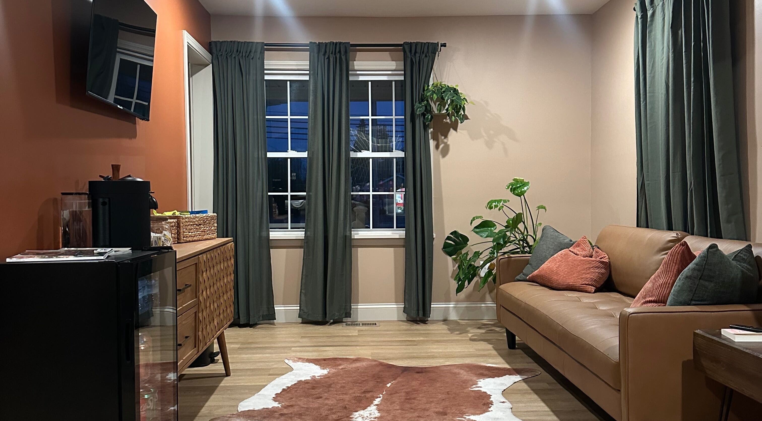 Inviting lounge area at Heather Schreiber, Niagara Falls, New York, US with elegant decor and comfy seating.