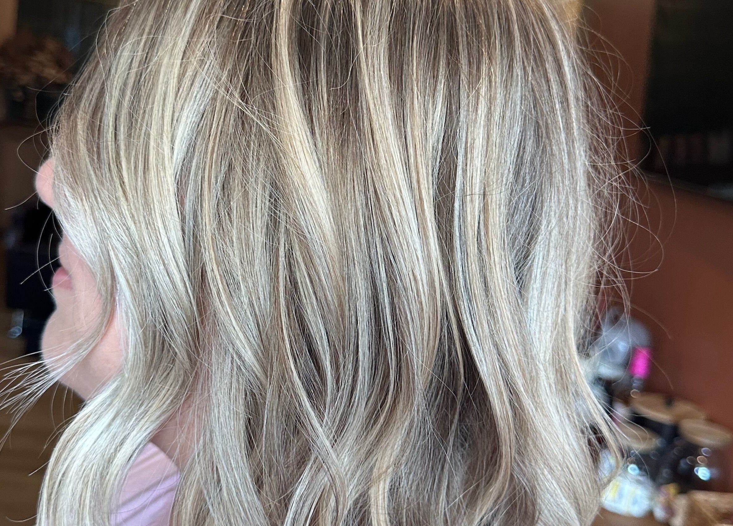 Blonde hair styled at Heather Schreiber, Niagara Falls, New York, US, showcasing soft waves and highlights.