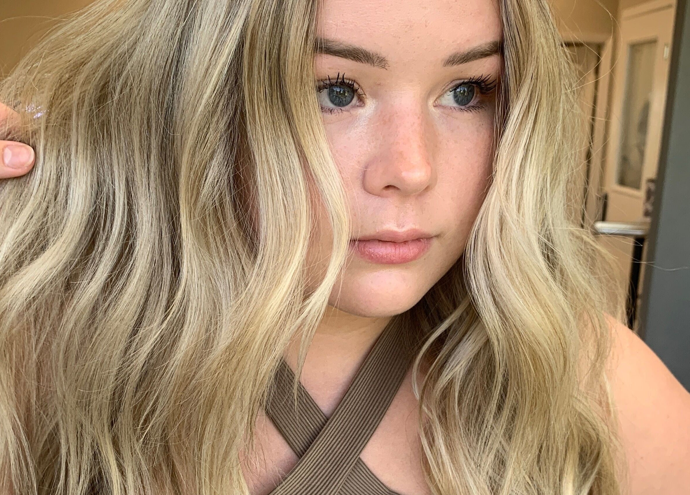 Blonde woman with soft waves styled at Heather Schreiber, Niagara Falls, New York, US.