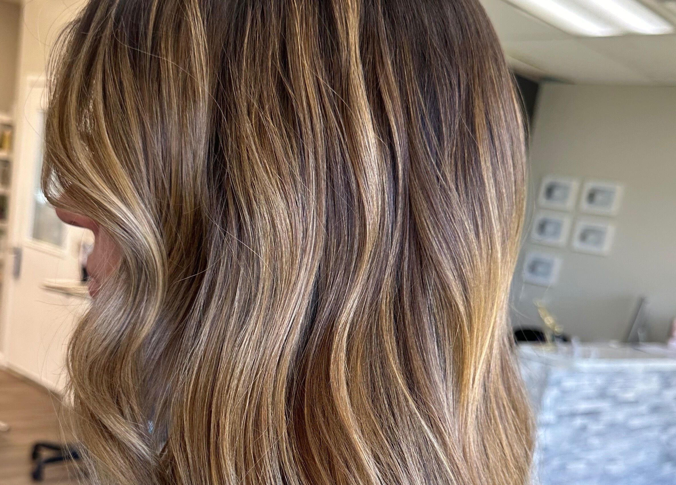 Gorgeous brown hair with highlights styled at Heather Schreiber, Niagara Falls, New York, US salon.