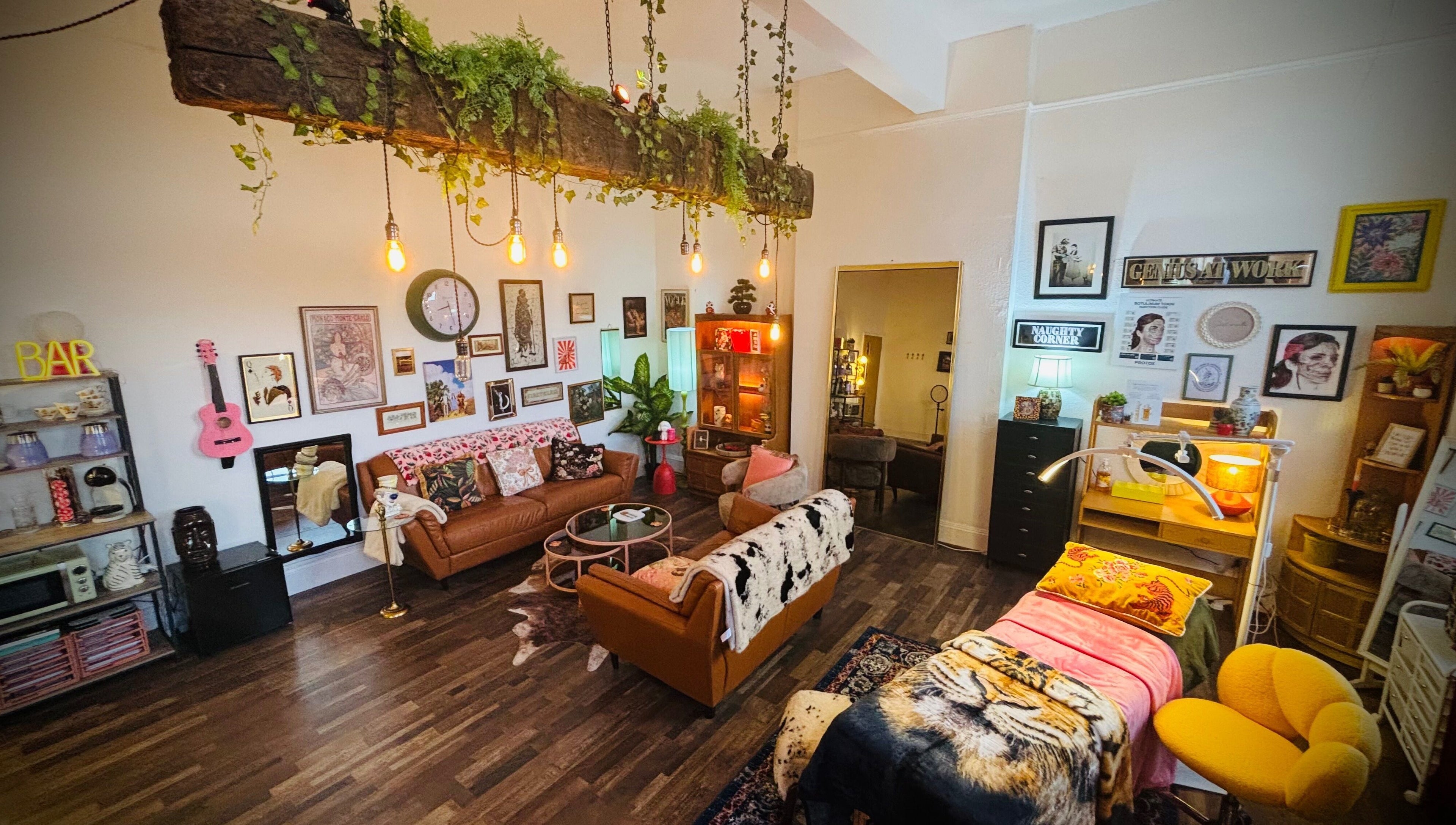 Warm, inviting room at Iris Medical Aesthetics, Cheltenham, England, GB, featuring eclectic decor and comfortable seating.