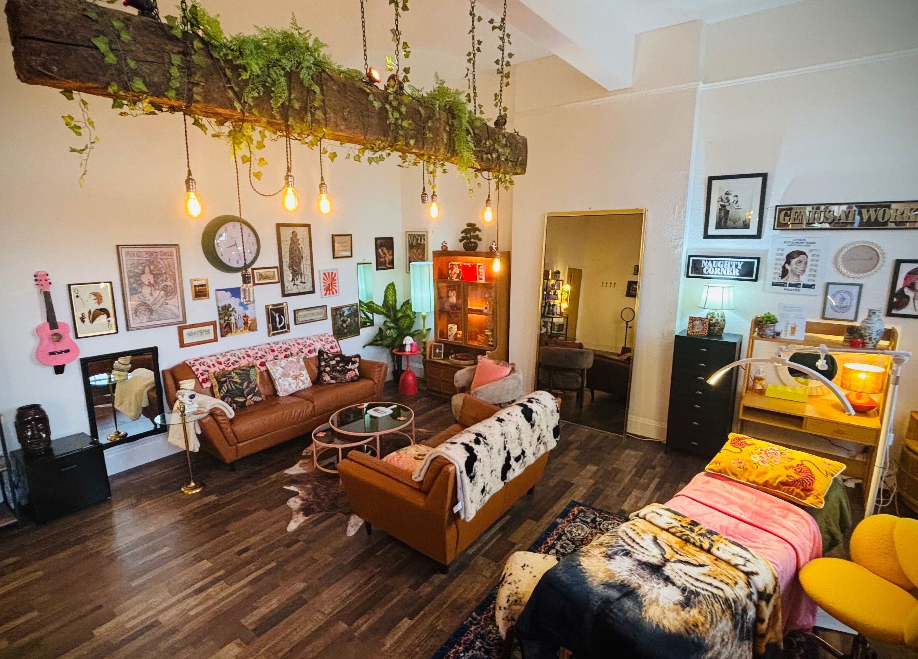 Warm, inviting room at Iris Medical Aesthetics, Cheltenham, England, GB, featuring eclectic decor and comfortable seating.