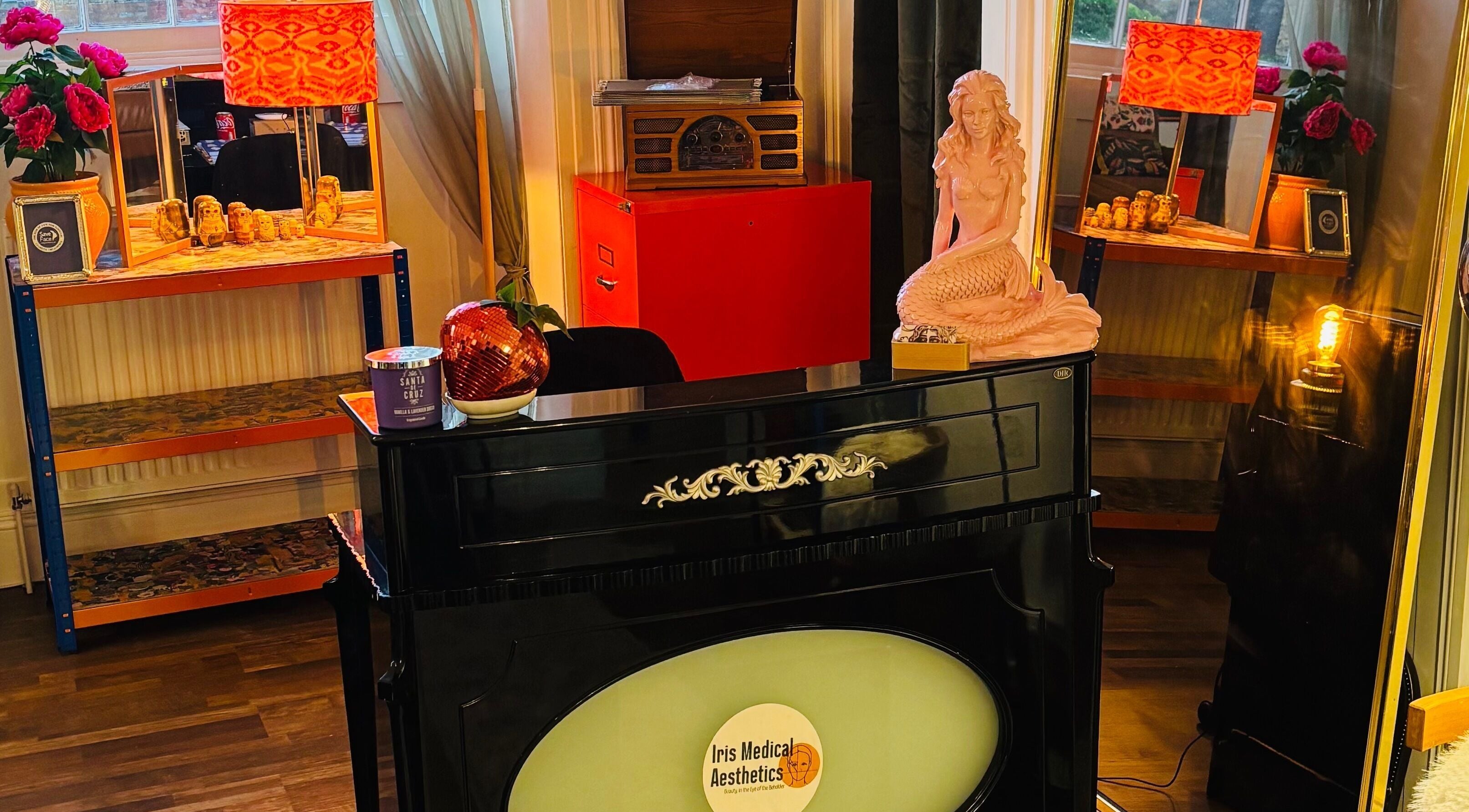 Cozy interior of Iris Medical Aesthetics in Cheltenham, England, GB with decor accents and warm lighting.