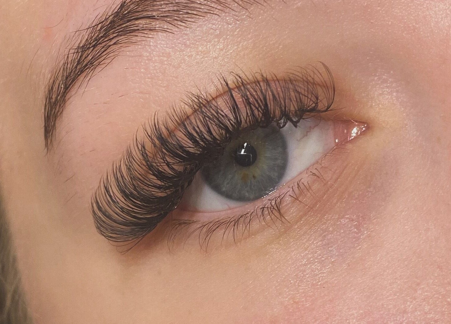 Close-up of eye with elegant eyelash extensions at Byciaralouise, Oswaldtwistle, England, GB.
