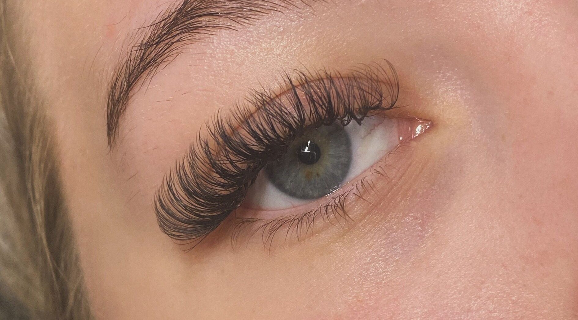 Close-up of eye with elegant eyelash extensions at Byciaralouise, Oswaldtwistle, England, GB.