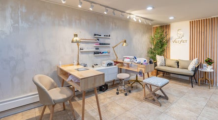 Modern interior of Velvet Beauty Studio, New York, New York, US, with chairs, tables, and beauty tools.