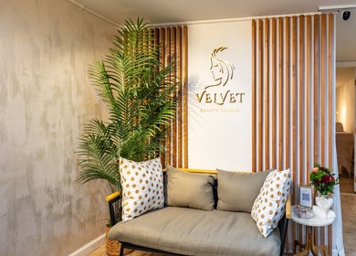 Chic seating area at Velvet Beauty Studio in New York, New York, US, with stylish decor and cozy cushions.