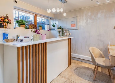 Velvet Beauty Studio's elegant reception in New York, New York, US, featuring modern decor and ambient lighting.