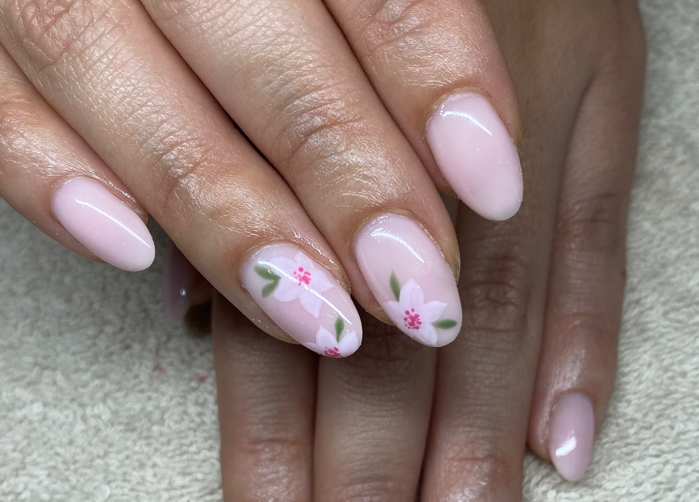 Elegant floral nail art at Complete Nails by Kristie, Lethabong, Gauteng, ZA showcasing pastel pink designs.