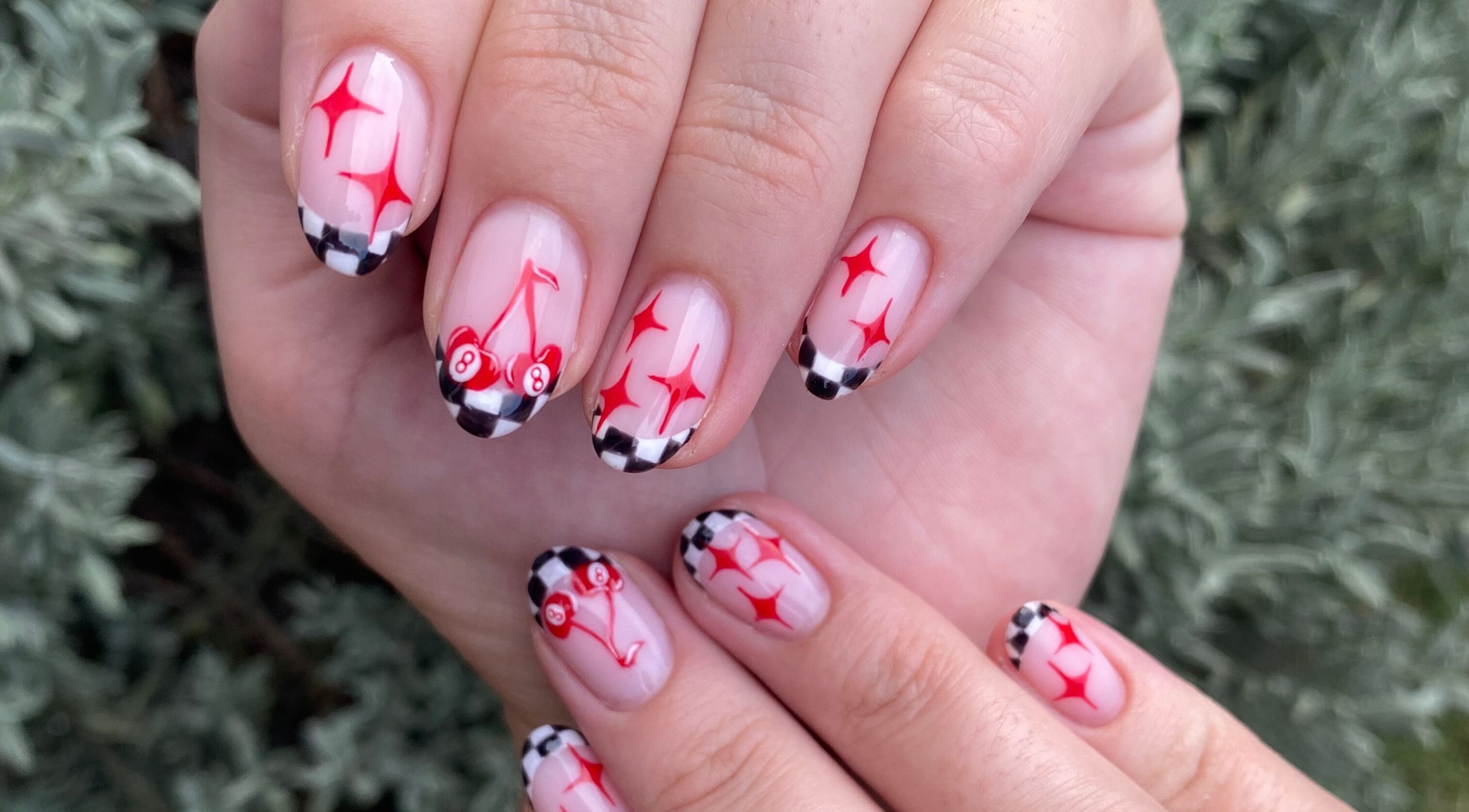 Stylish nail art with cherries and stars at Complete Nails by Kristie in Lethabong, Gauteng, ZA.