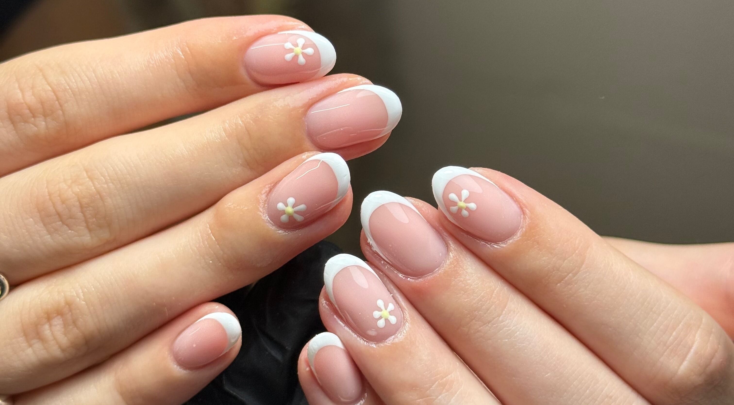 Beautiful French manicure with floral designs at Adorebeauty, Bletchley, England, GB.