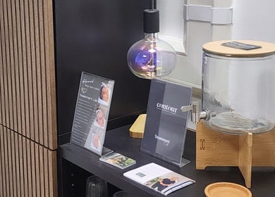 Kintsugi Beauty & Holistics showcase with brochures and water dispenser in Newton Abbot, England, GB.