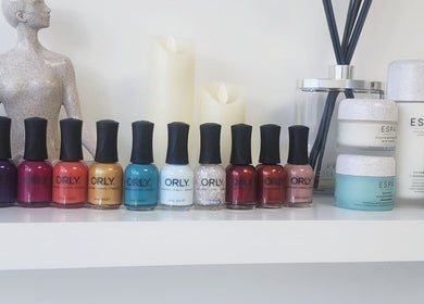 Colorful nail polishes and spa products on display at Kintsugi Beauty & Holistics, Newton Abbot, England, GB.