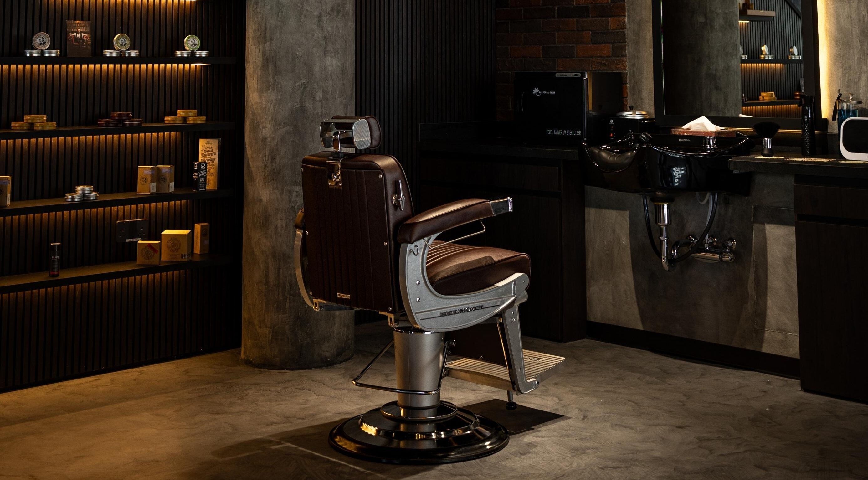 Stylish barber chair at Stache & Co. Barbershop - Reem Central Park, Abu Dhabi, AE showcasing vintage elegance.