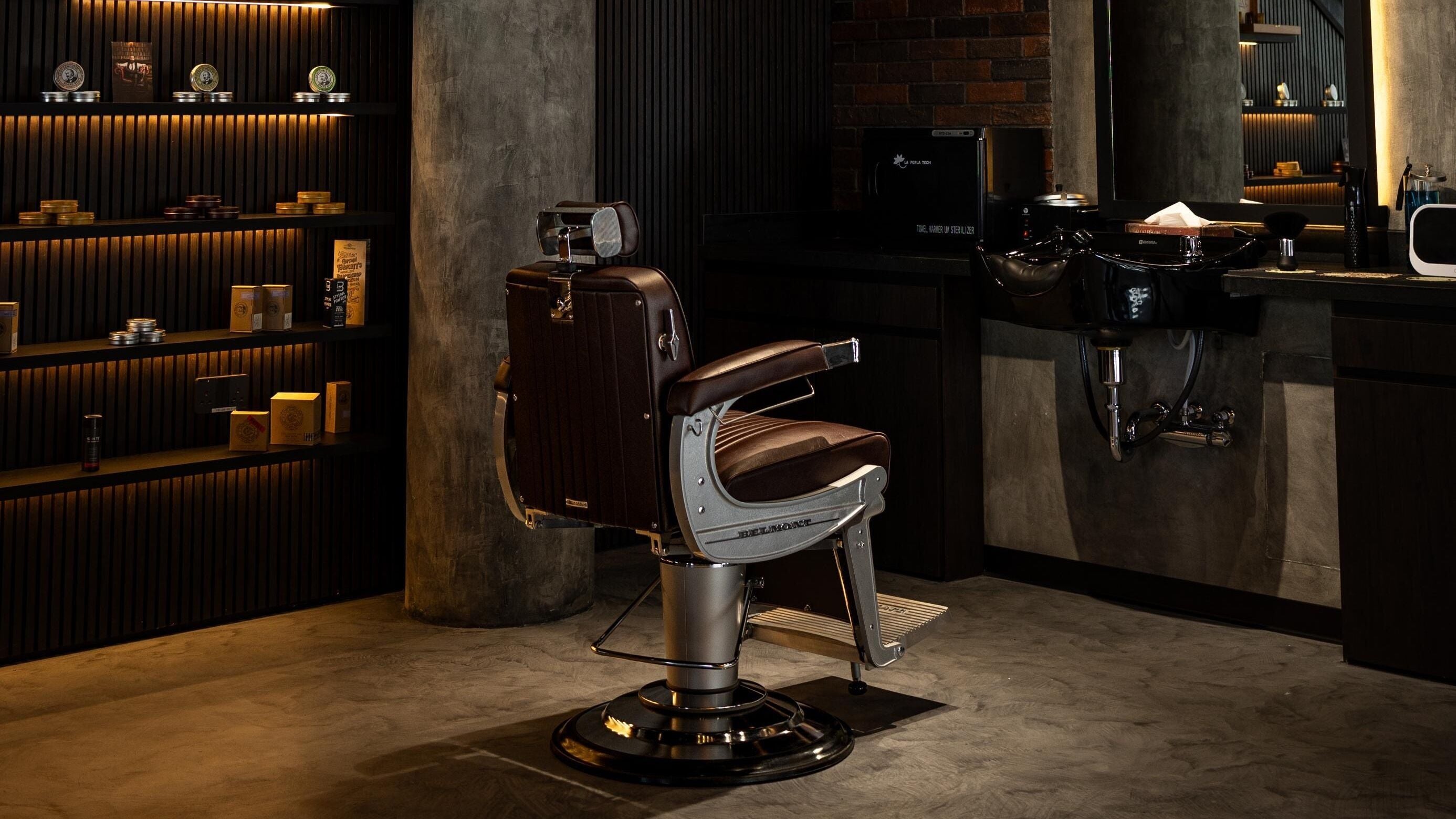 Stylish barber chair at Stache & Co. Barbershop - Reem Central Park, Abu Dhabi, AE showcasing vintage elegance.