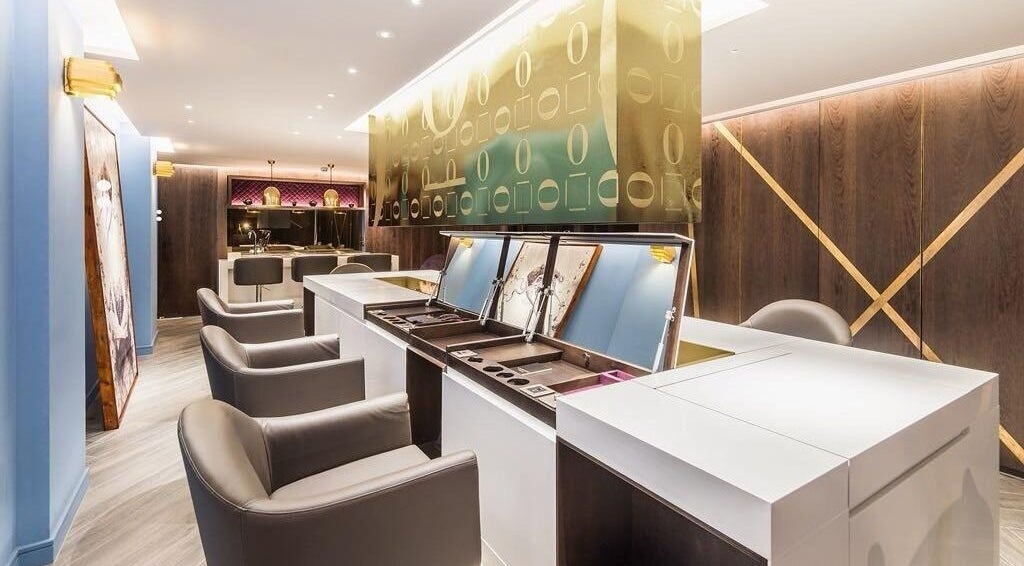 Luxurious interior of SALON64, London, England, GB, featuring elegant seating and stylish decor.