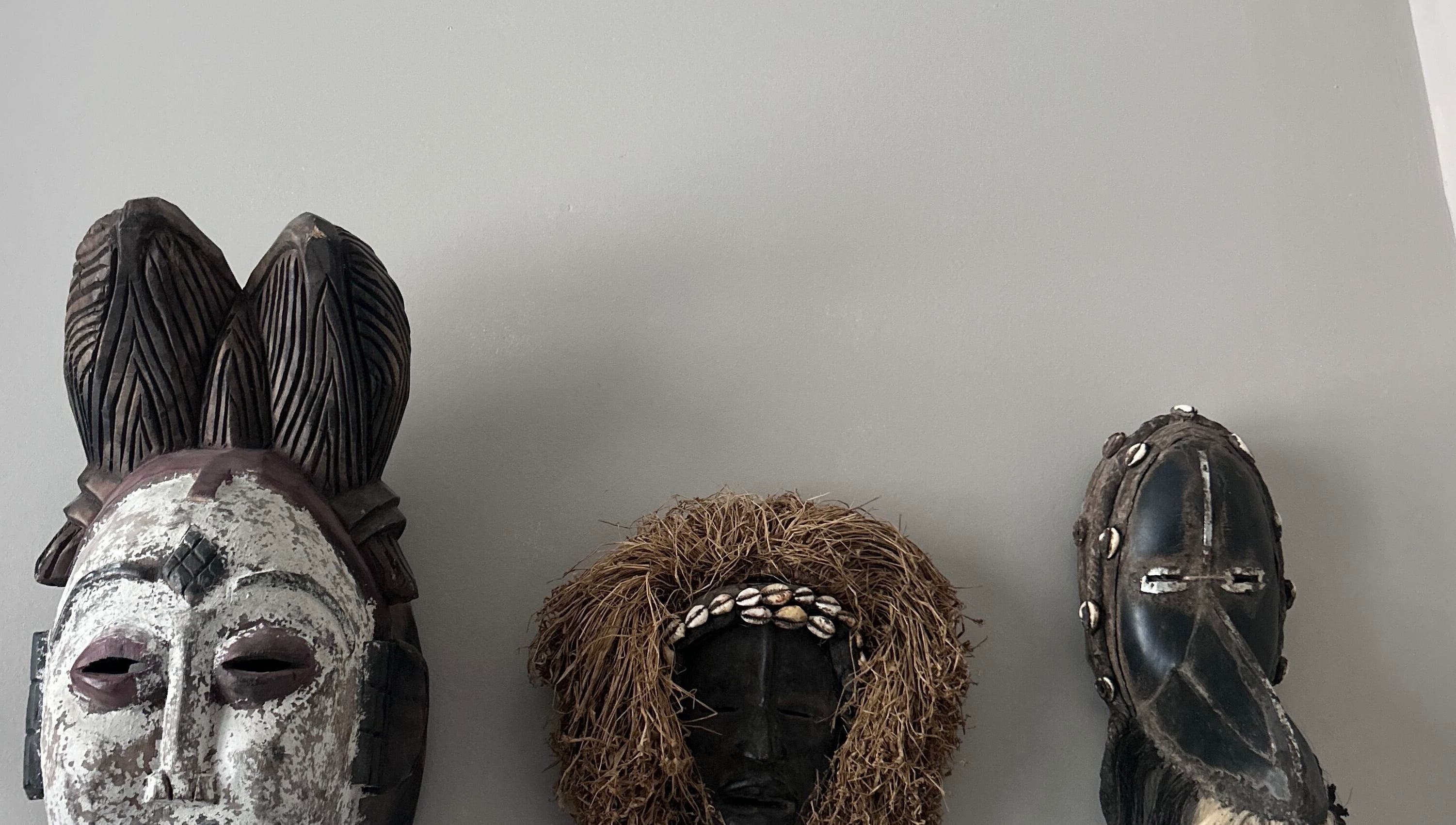 Artistic masks on display at La Caverne, Calgary, Alberta, CA showcasing cultural diversity and creativity.