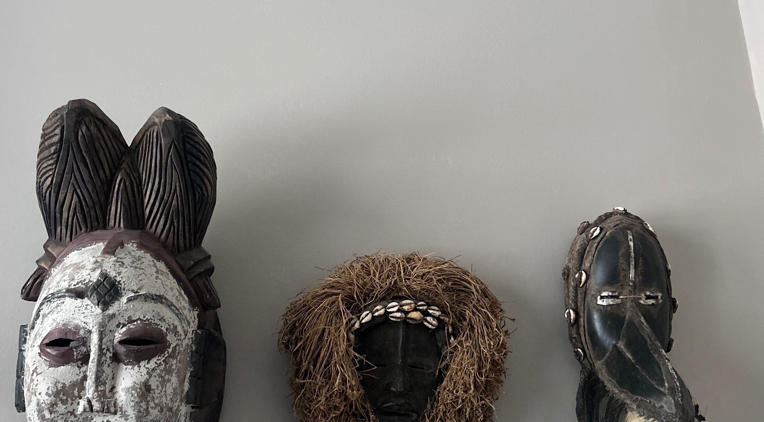 Artistic masks on display at La Caverne, Calgary, Alberta, CA showcasing cultural diversity and creativity.