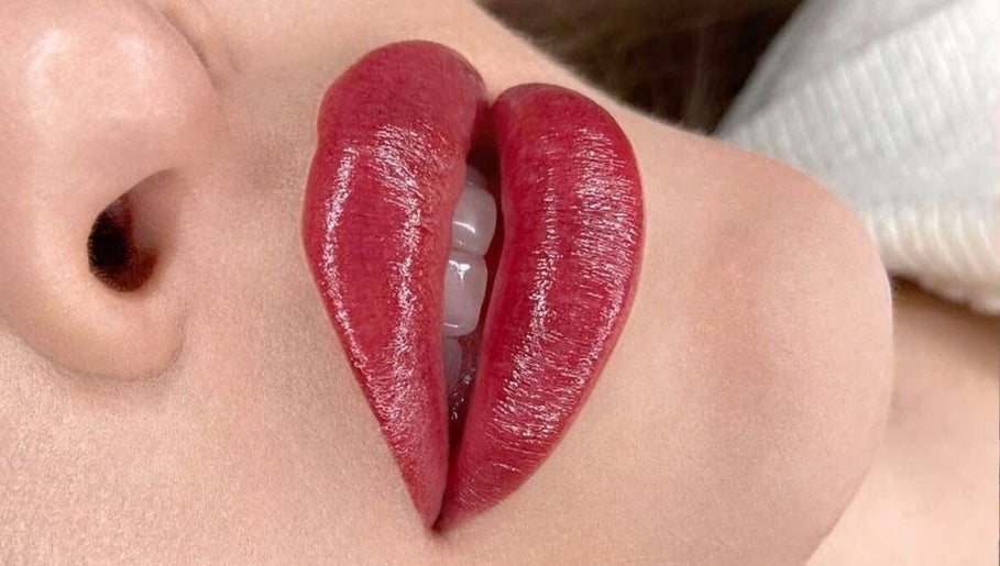 Close-up of glossy red lips at Oh Honey Beauty, Subiaco, Western Australia, AU.