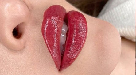 Close-up of glossy red lips at Oh Honey Beauty, Subiaco, Western Australia, AU.