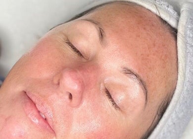 A serene woman receiving a facial at The Glow House, Hutton Rudby, England, GB.