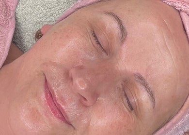 A relaxed client enjoying a facial treatment at The Glow House, Hutton Rudby, England, GB.