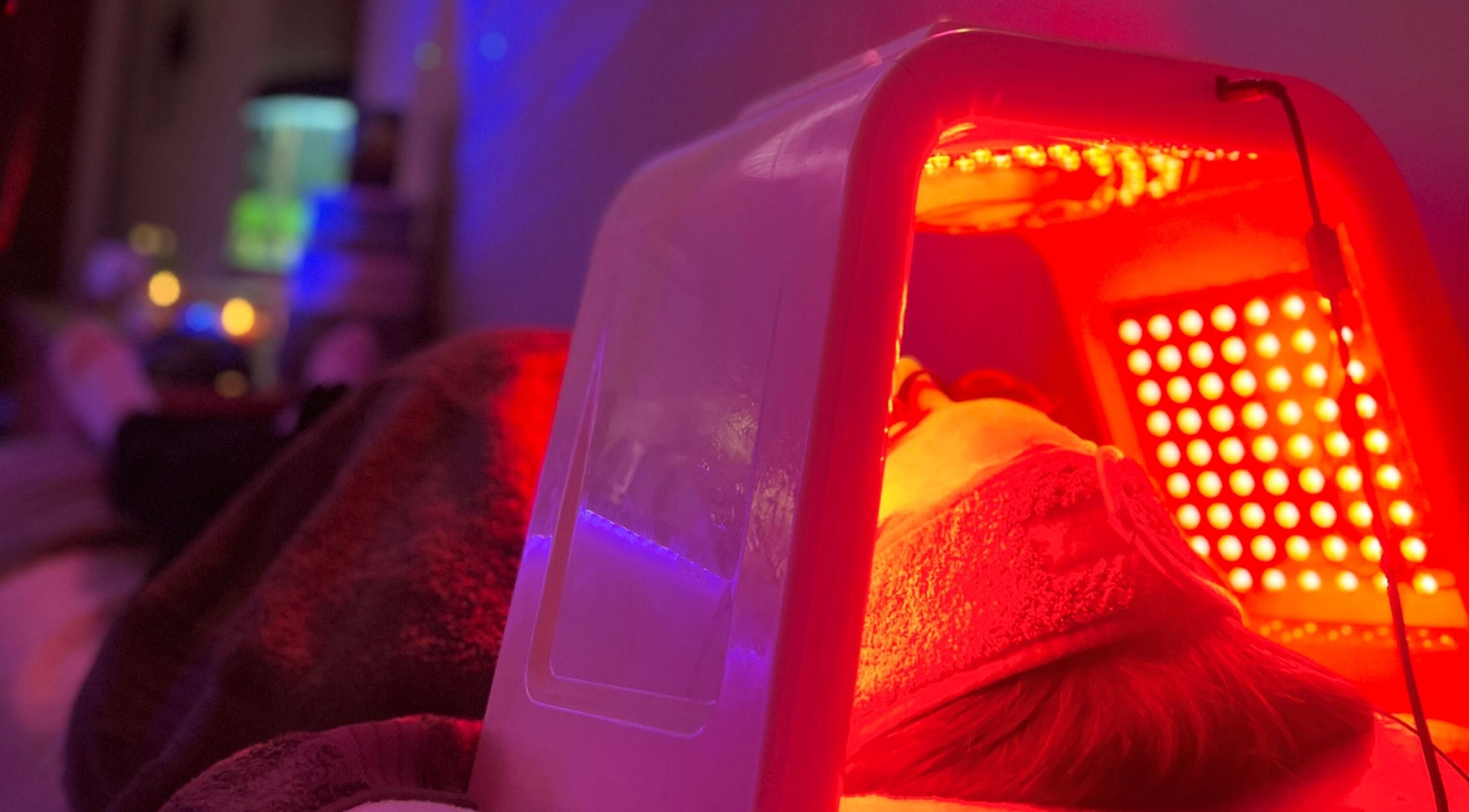 LED therapy session at The Glow House, Hutton Rudby, England, GB with soothing red light.