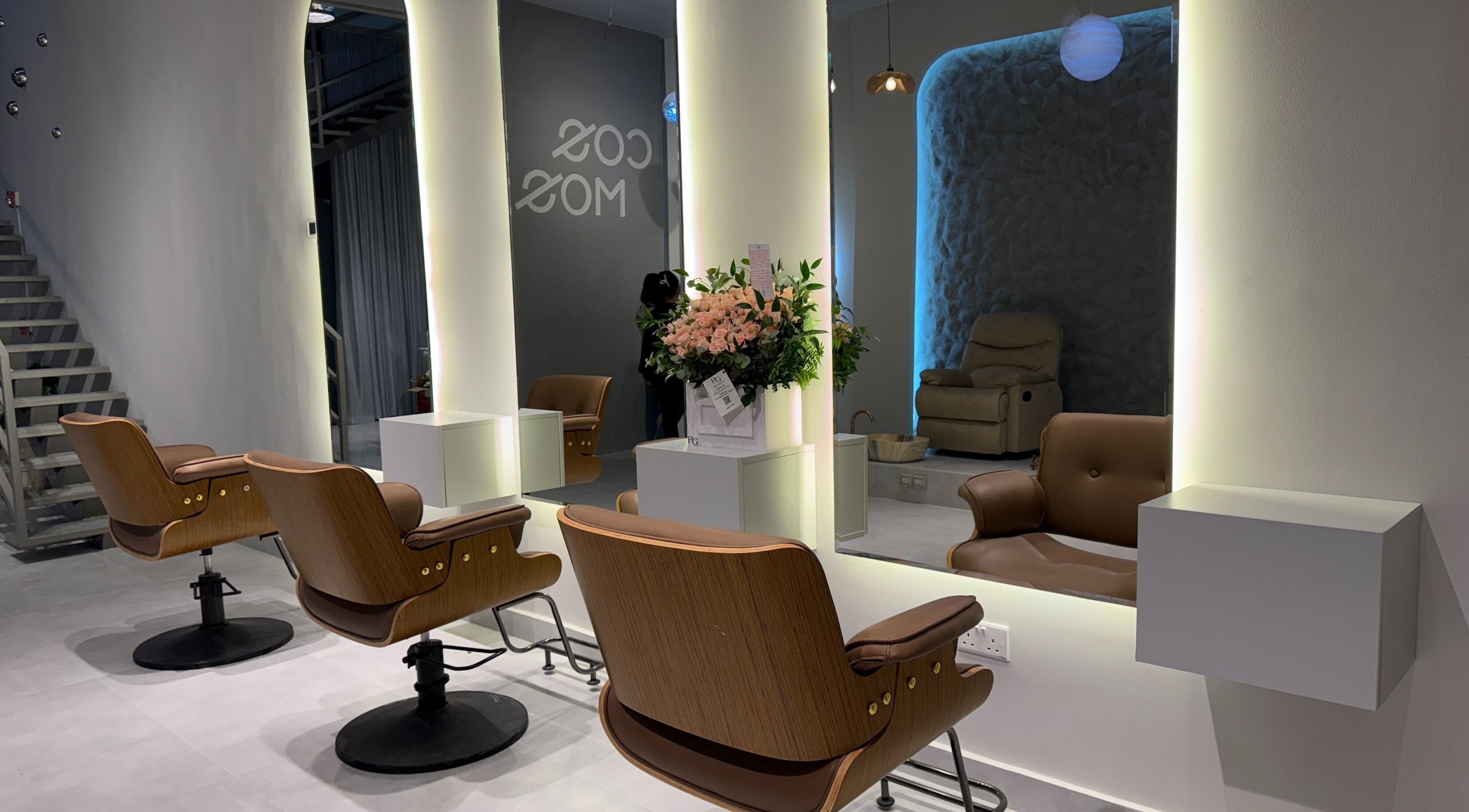 Modern salon chairs and mirrors at Cosmos Beauty Salon, Lusail, Doha Municipality, QA.