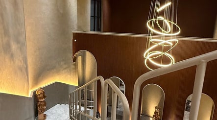 Modern staircase with unique lighting at March 14 Beauty Residence, Dubai, Dubai, AE.