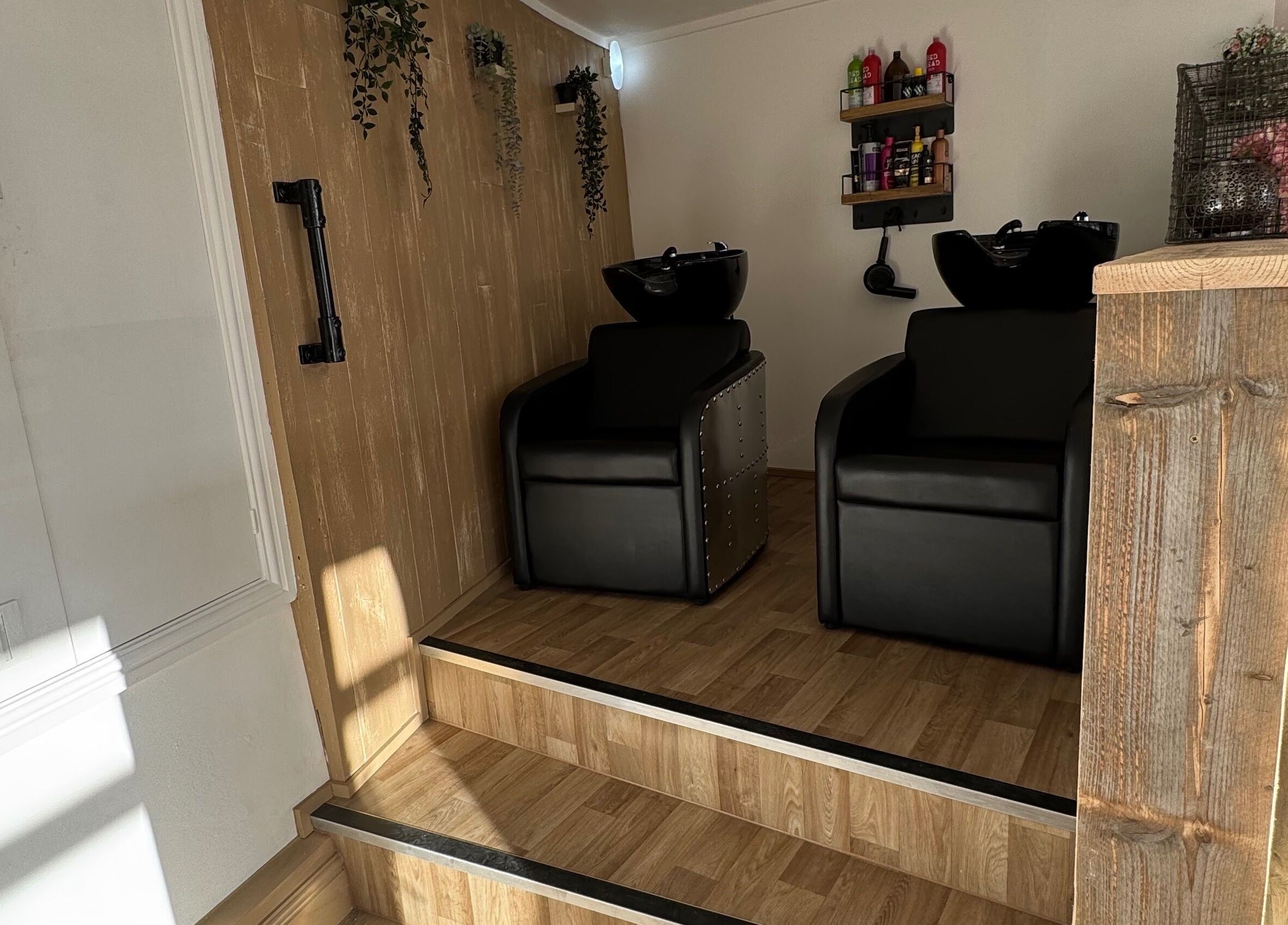 Elegant hair wash stations at The Curious Stylist, Bovey Tracey, England, GB, offering a relaxing experience.