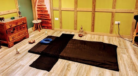 Tranquil massage room at Balance and Heal in Royston, England, GB, featuring a rustic wooden decor.