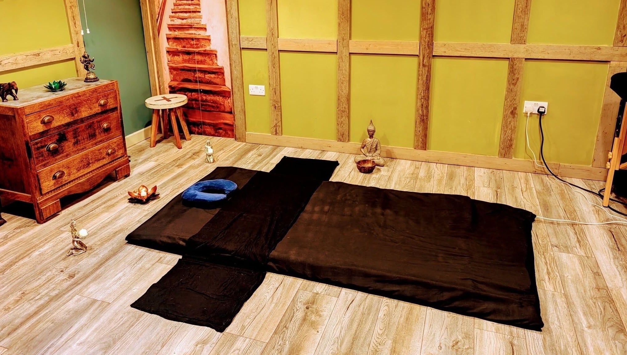 Relaxation space at Balance and Heal, Royston, England, GB featuring a mat and serene decor.