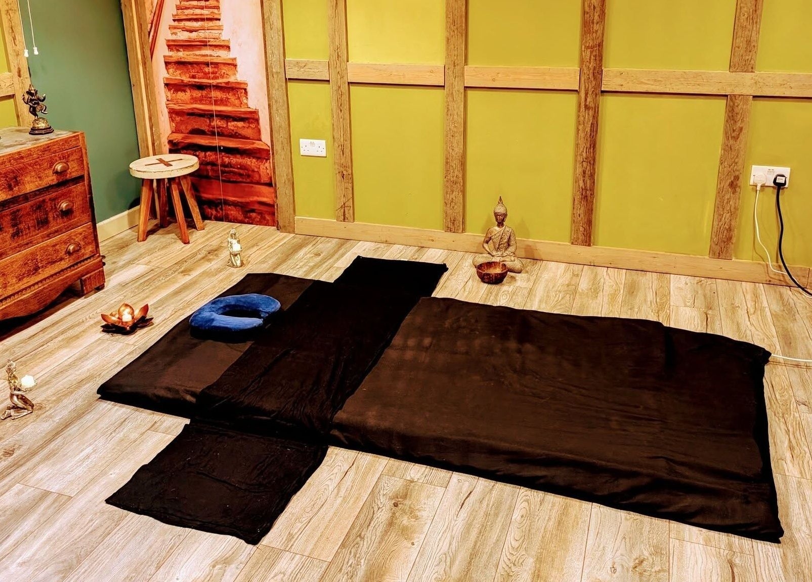 Relaxation space at Balance and Heal, Royston, England, GB featuring a mat and serene decor.