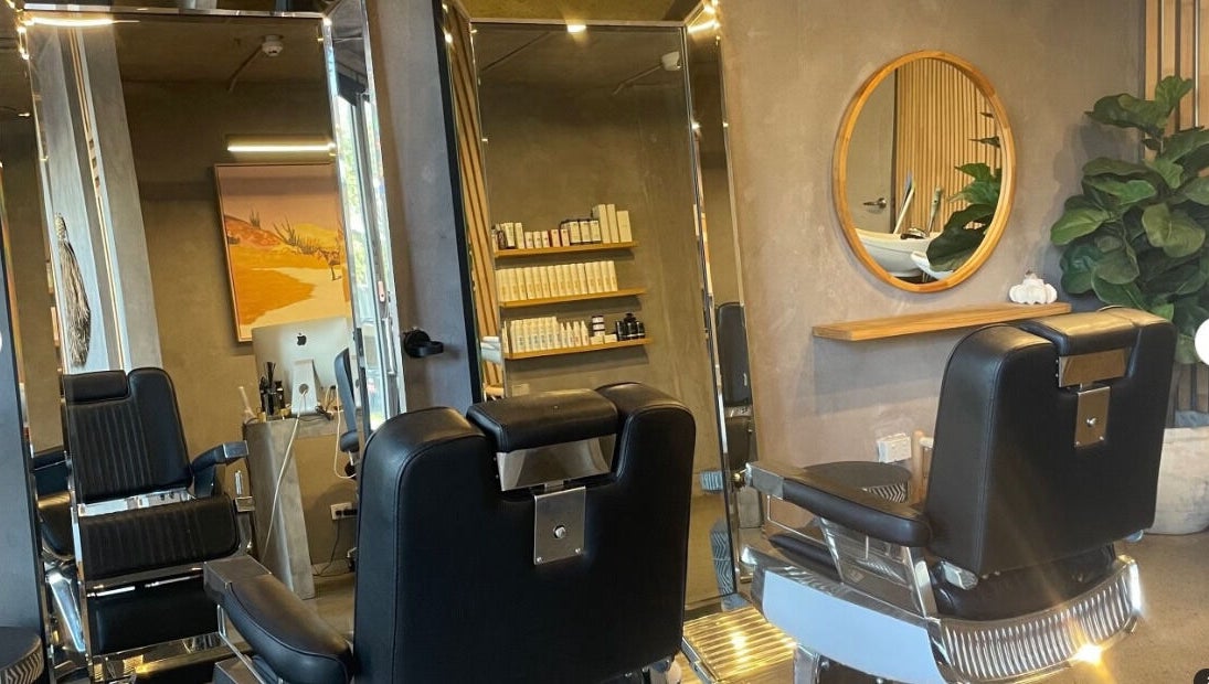 Modern salon chairs at Nikola Krstev Salon, Wollongong, New South Wales, AU with stylish decor and products.
