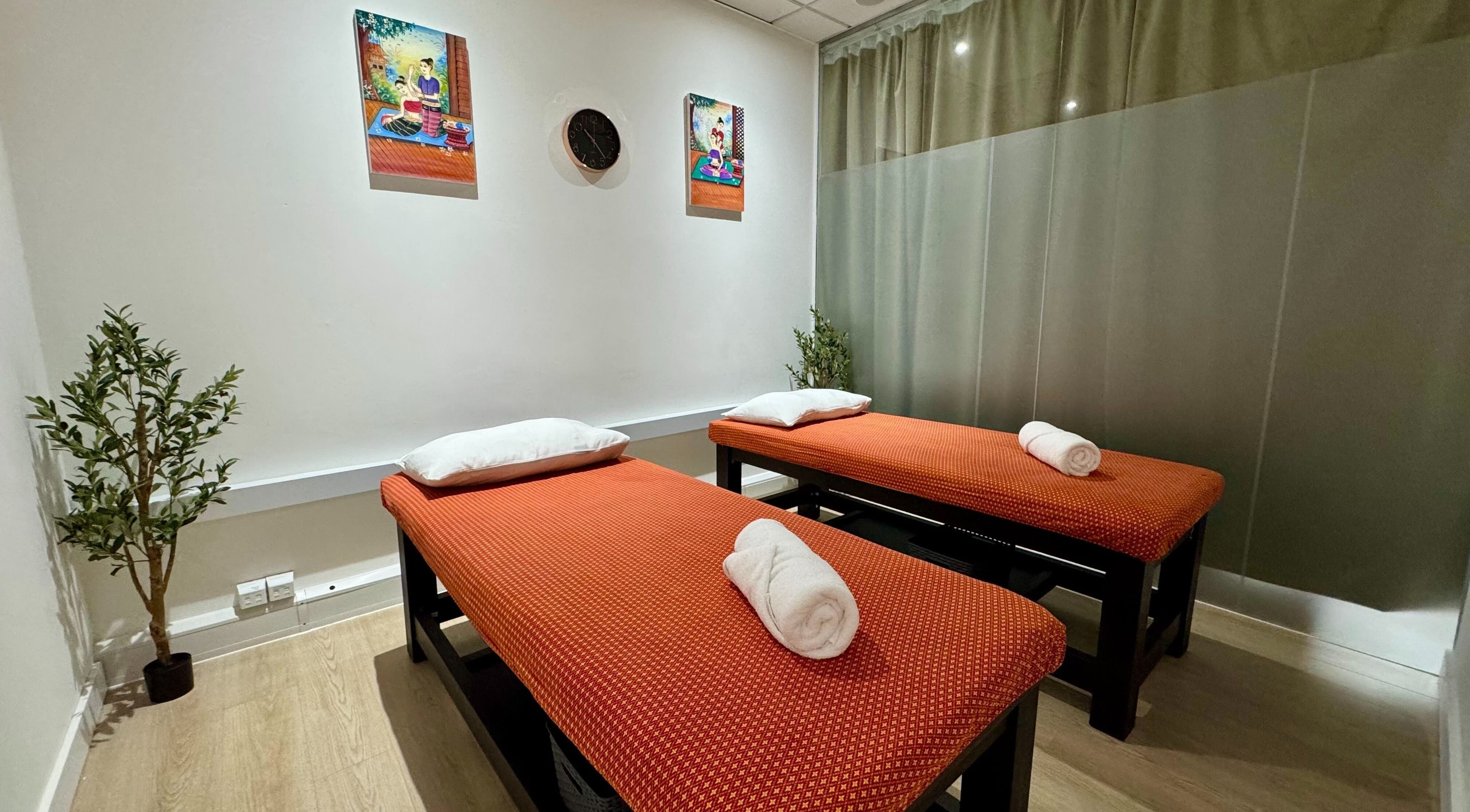 Calming massage room at Nuad Thai Boran - Leeds Regent Street, Leeds, England, GB with twin massage tables.