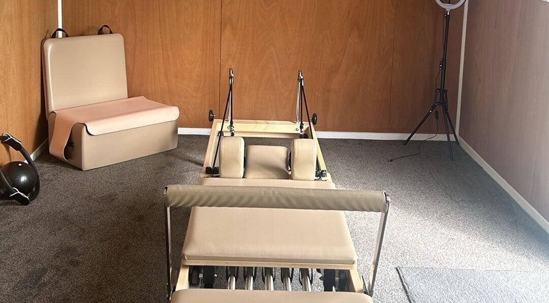 Spacious Reformer Pilates studio in Levin, Manawatū-whanganui, NZ with modern equipment setup.