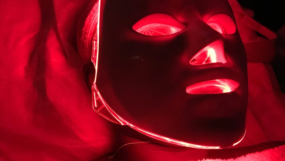 Red LED light therapy mask at Purple Linen Aesthetics and Spa, Lekki, Lagos, NG offering rejuvenating treatments.