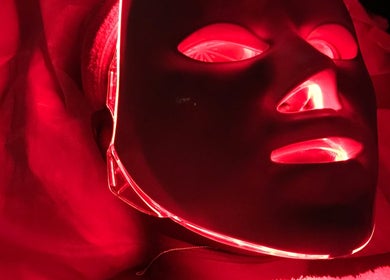 Red LED light therapy mask at Purple Linen Aesthetics and Spa, Lekki, Lagos, NG offering rejuvenating treatments.