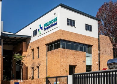 Lux Clinic's modern brick exterior in Johannesburg, Gauteng, ZA, showcasing a serene wellness atmosphere.