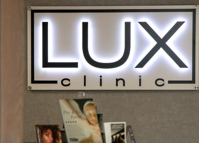 Illuminated Lux Clinic sign at Johannesburg, Gauteng, ZA, showcasing modern elegance.