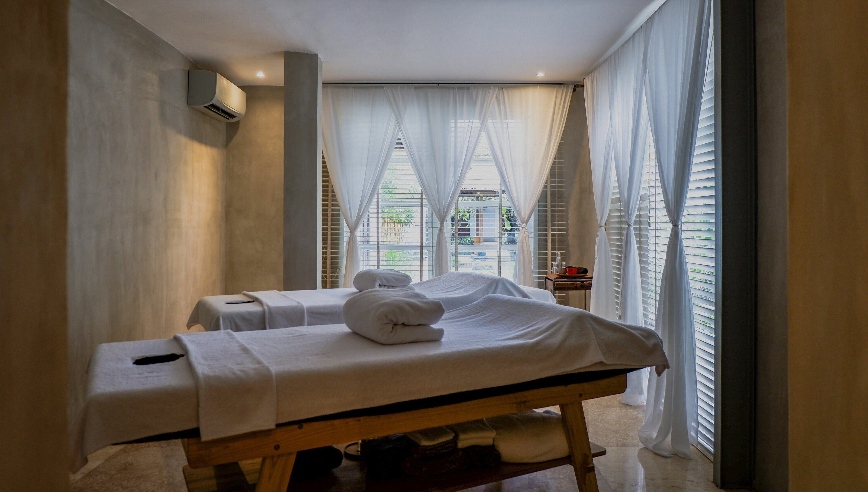 Relaxing massage tables at Terra Spa & Wellness in Bali, Bali, ID with soft lighting and gentle ambiance.