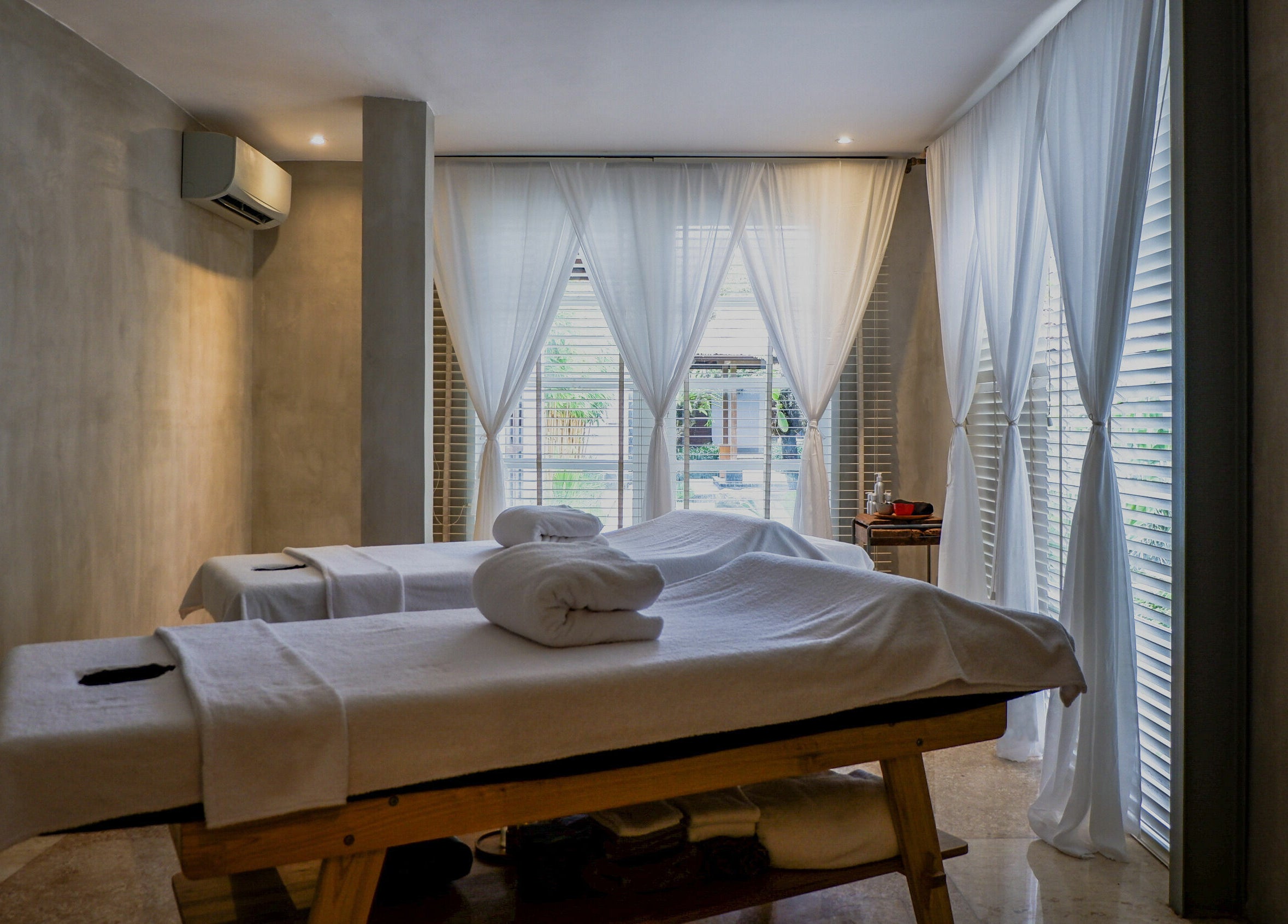 Relaxing massage tables at Terra Spa & Wellness in Bali, Bali, ID with soft lighting and gentle ambiance.