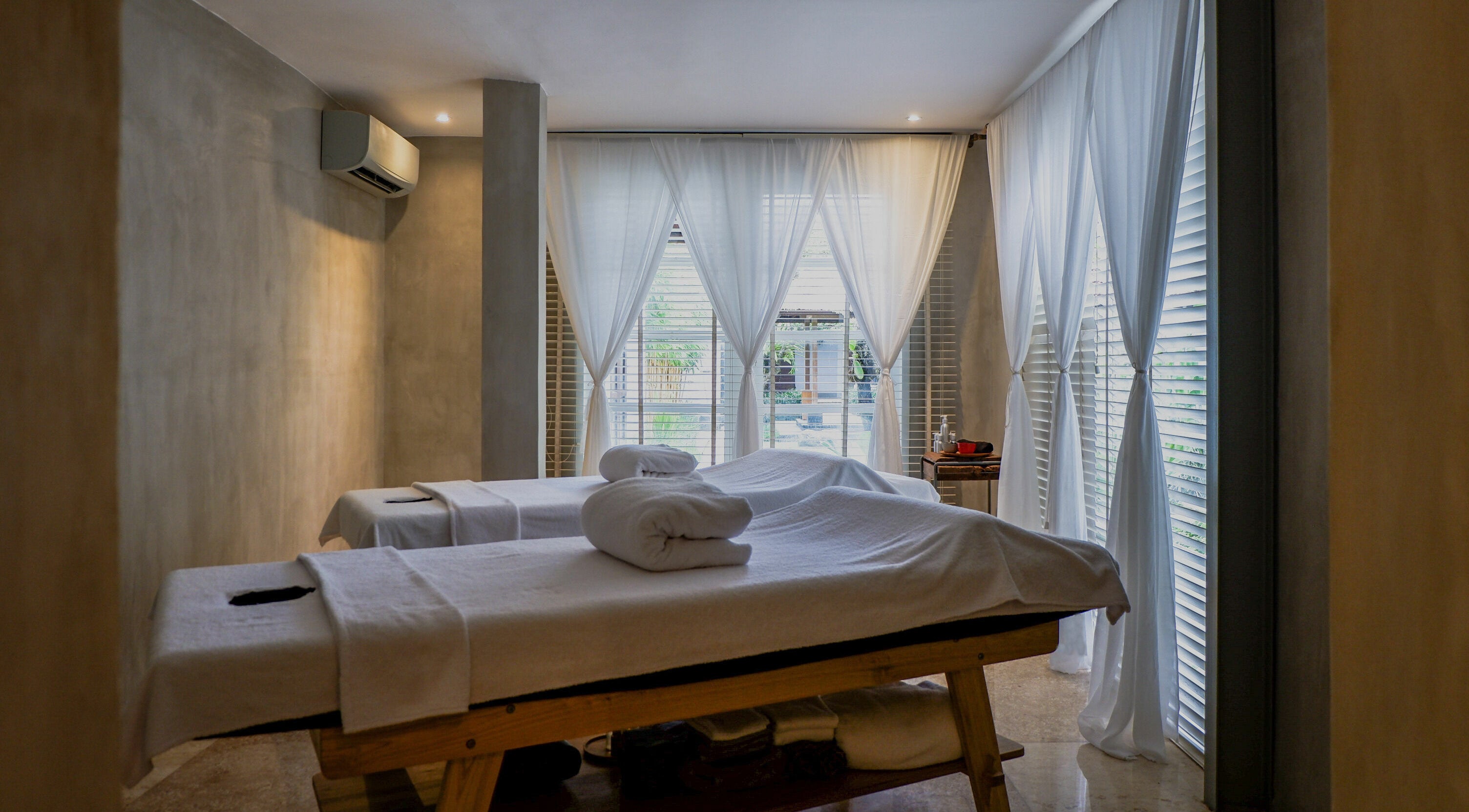 Relaxing massage tables at Terra Spa & Wellness in Bali, Bali, ID with soft lighting and gentle ambiance.