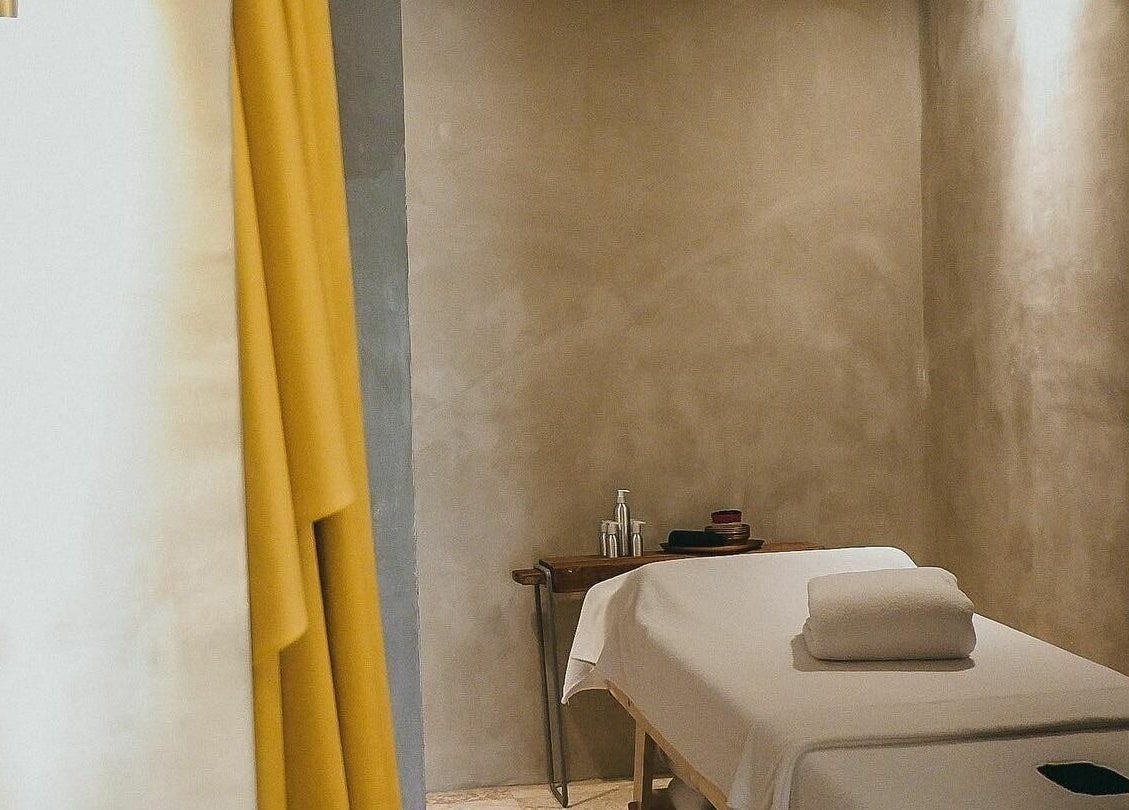 Tranquil massage room at Terra Spa & Wellness, Bali, Bali, ID, featuring soft lighting and a cozy massage table.